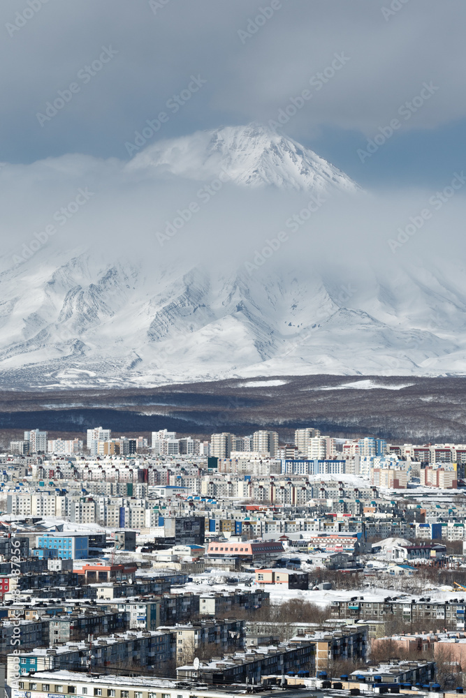 City Petropavlovsk-Kamchatsky and active Koryaksky Volcano