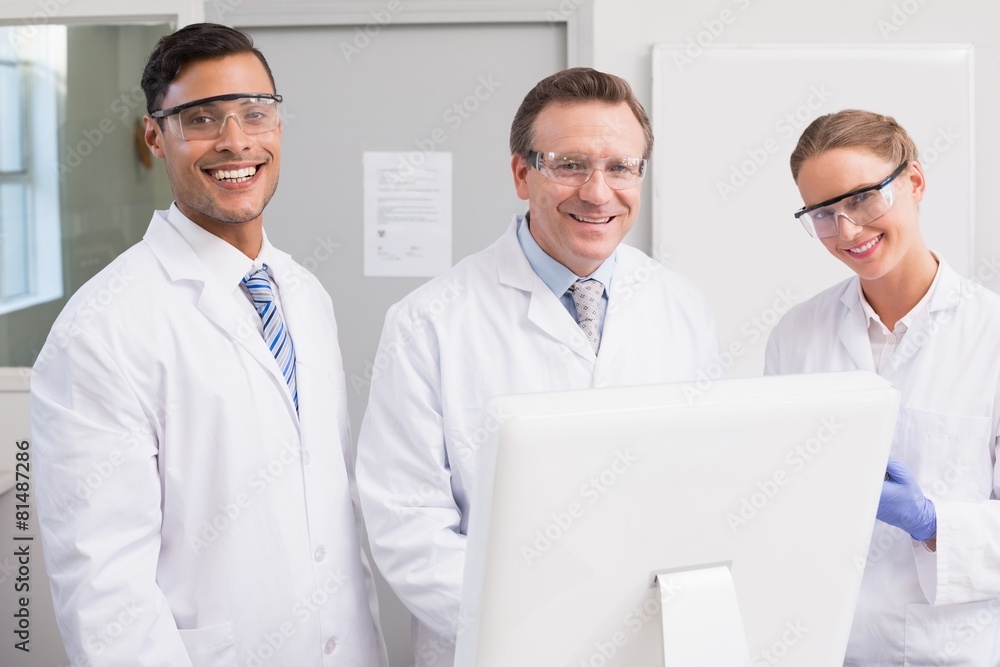 Fototapeta premium Scientists smiling and looking at camera