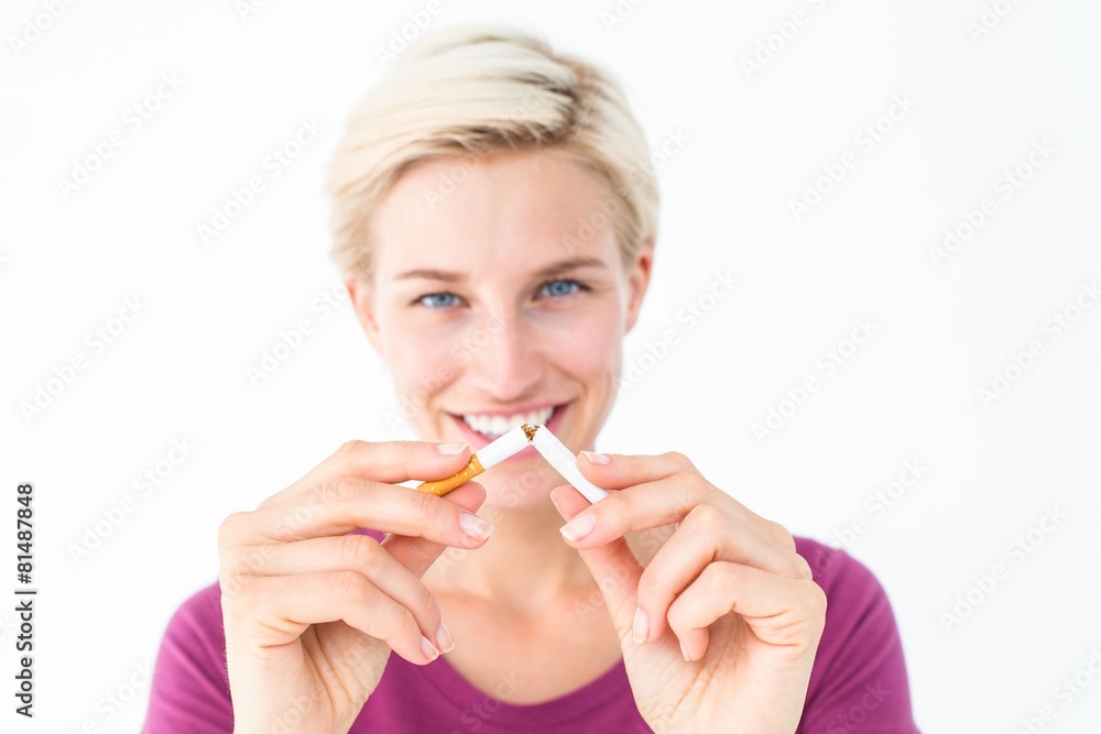 Naklejka premium Pretty blonde breaking cigarette