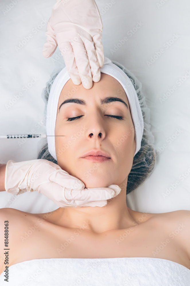 Closeup of woman getting cosmetic injection in the face Closeup of woman getting cosmetic injection in the face