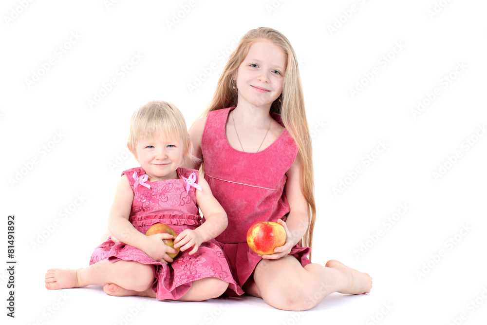 adorable little two sisters 9 year and 1 year old with apple o adorable little two sisters 9 year and 1 year old with apple o