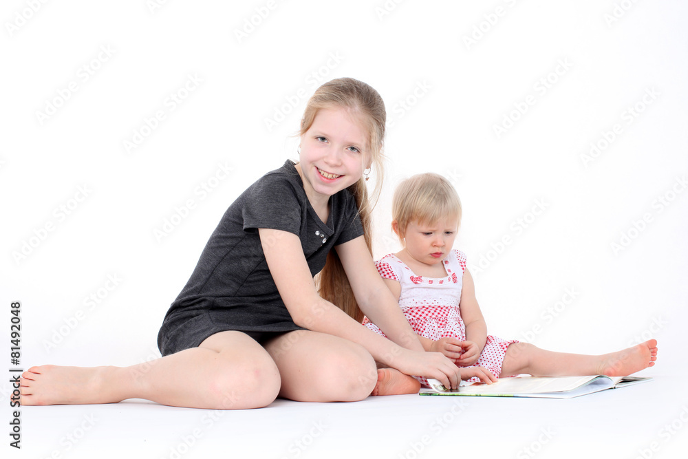 adorable little two sisters 9 year and 1 year old read book adorable little two sisters 9 year and 1 year old read book