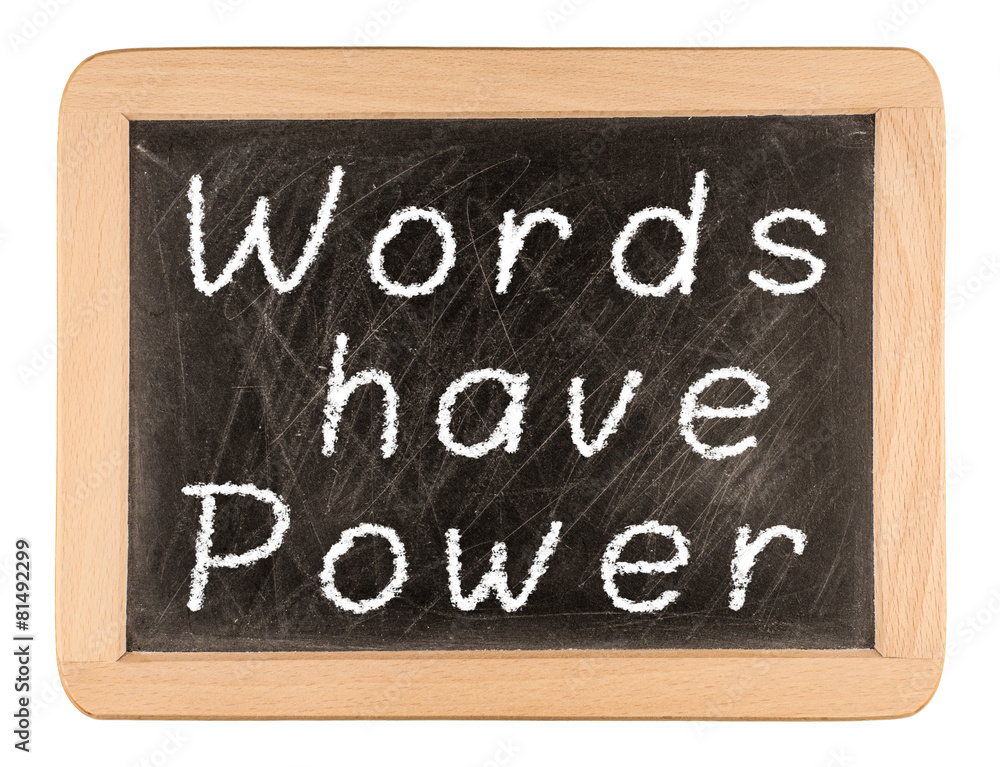 The phrase Words Have Power written in white chalk on a used bla The phrase Words Have Power written in white chalk on a used bla