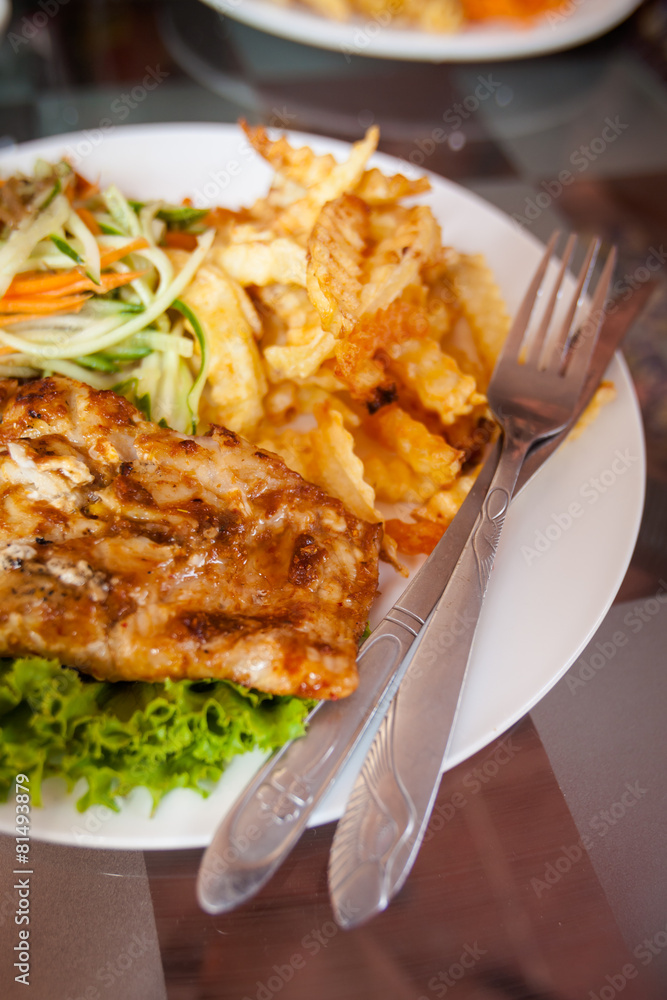 Cambodian fish barbeque with fries Cambodian fish barbeque with fries