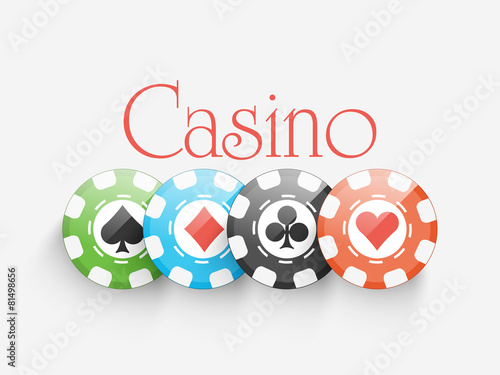 Colorful Casino chips on grey background.