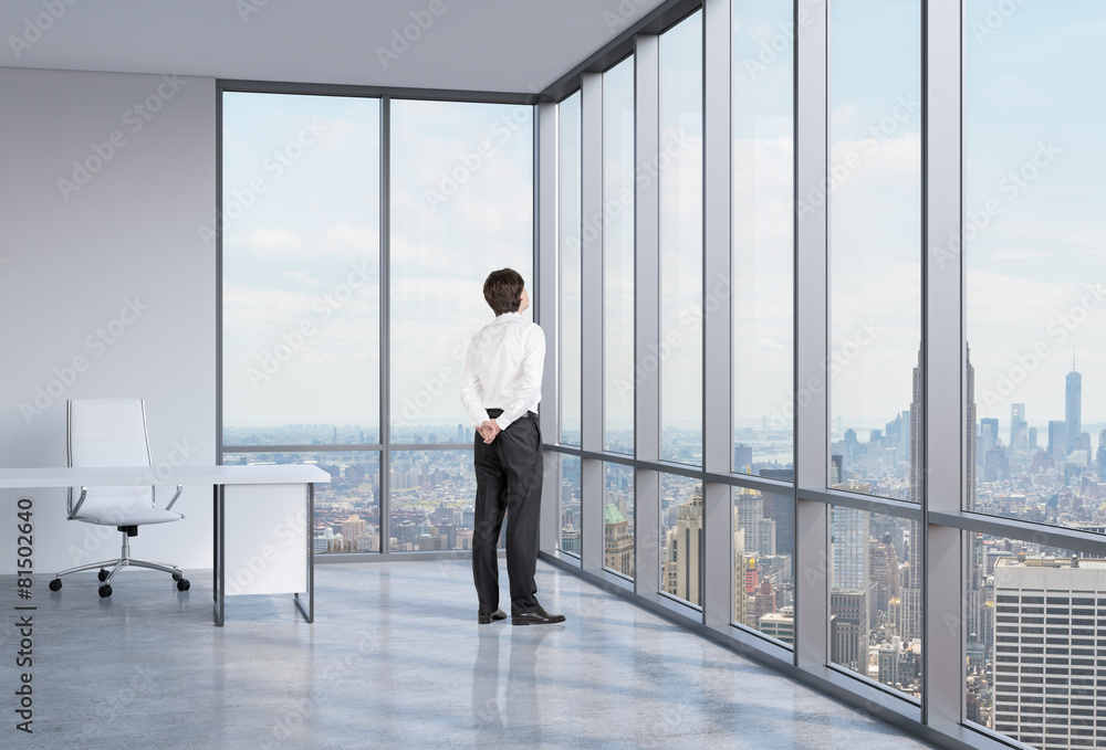 businessman is looking through the corner window. businessman is looking through the corner window.