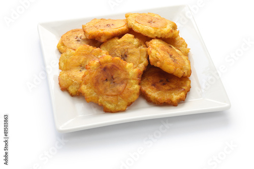 tostones, fried green plantain banana chips photo