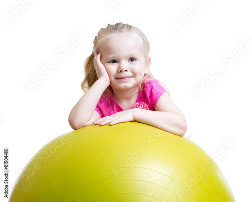 Kid girl having fun with gy...