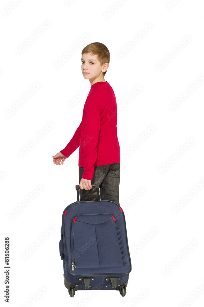 Boy holding travel bag walking away isolated on white Boy holding travel bag walking away isolated on white
