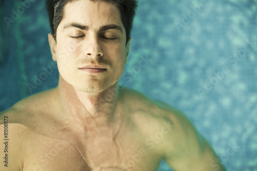 Young man floating in the s...