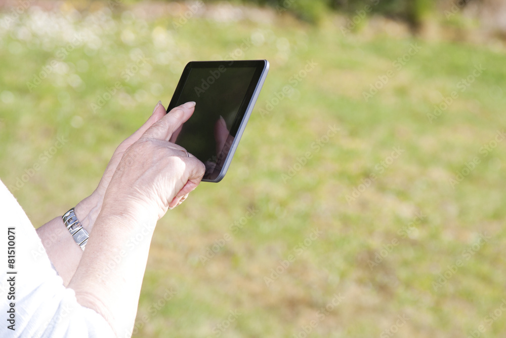 woman with mobile tablet outdoors
