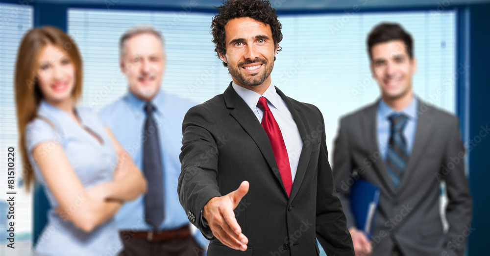 Successful businessman giving you his hand Successful businessman giving you his hand