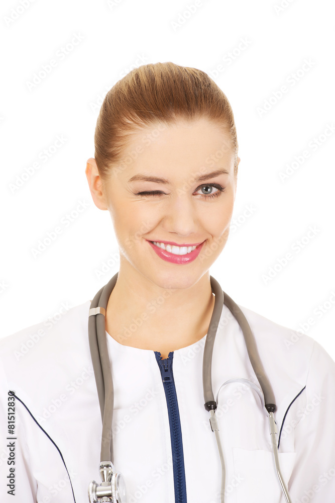Medical doctor woman blinks eye. Medical doctor woman blinks eye.