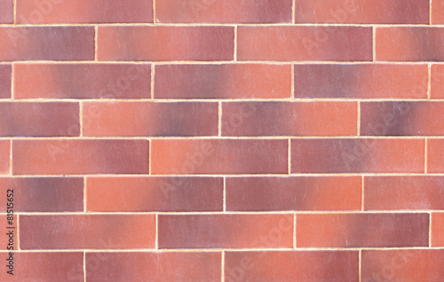 Wall of red decorative bricks.