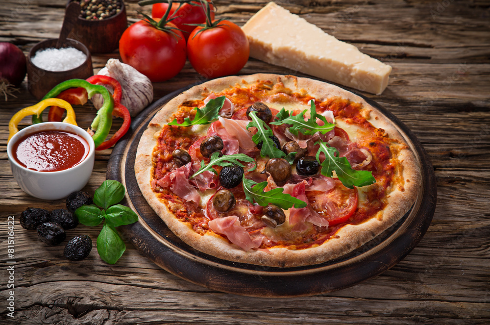 Delicious italian pizza served on wooden table Delicious italian pizza served on wooden table