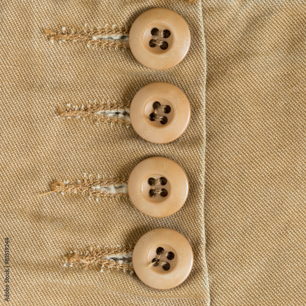 design botton of brown shirt on fabric textile background design botton of brown shirt on fabric textile background