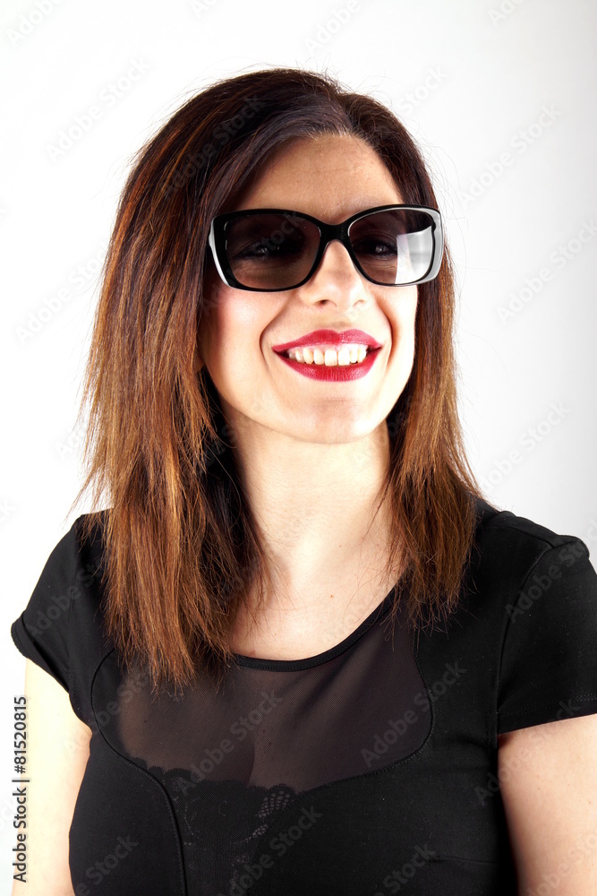 Studio shot of a woman with sunglasses Studio shot of a woman with sunglasses