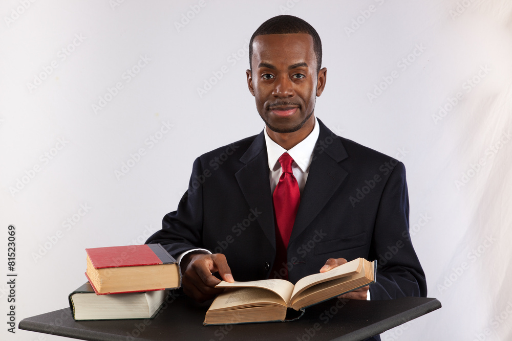 Black businessman reading a book Black businessman reading a book