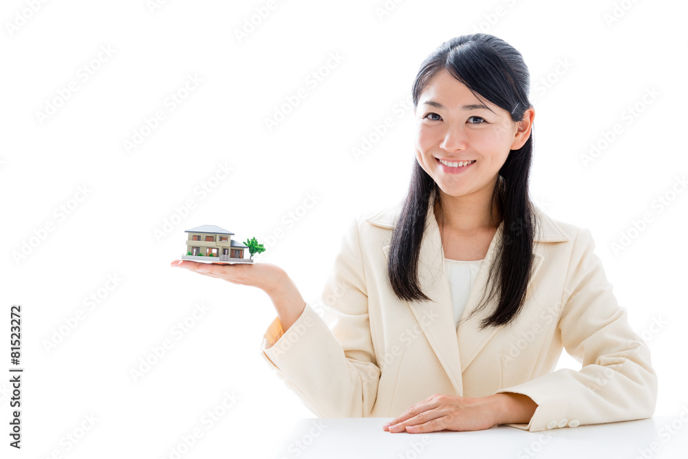 asian businesswoman with miniature house asian businesswoman with miniature house