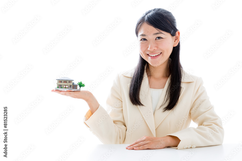 asian businesswoman with miniature house asian businesswoman with miniature house