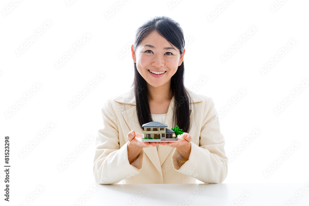 asian businesswoman with miniature house asian businesswoman with miniature house