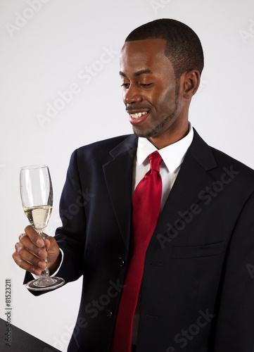 Black businessman with Champaign