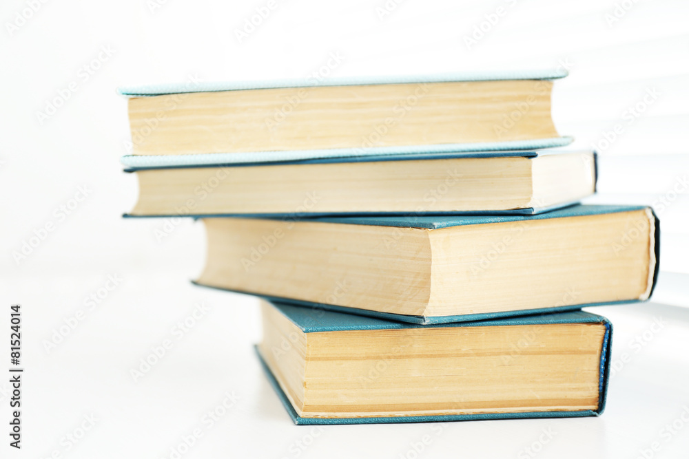 Books on white windowsill, close up Books on white windowsill, close up