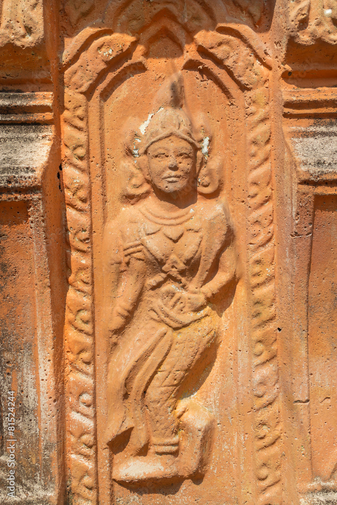 the ancient stone carving for dancing deva on the pagoda
