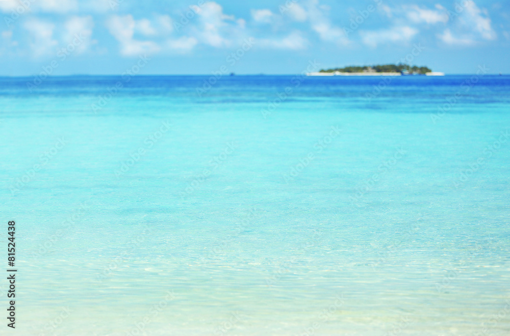 View of beautiful blue ocean water and bungalows in Baros