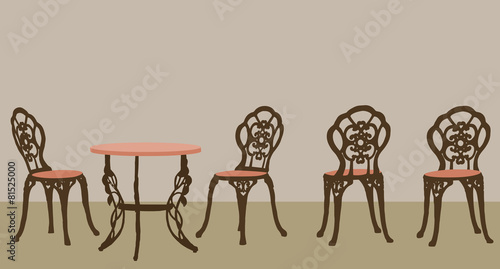 Set of ornate table and chairs.