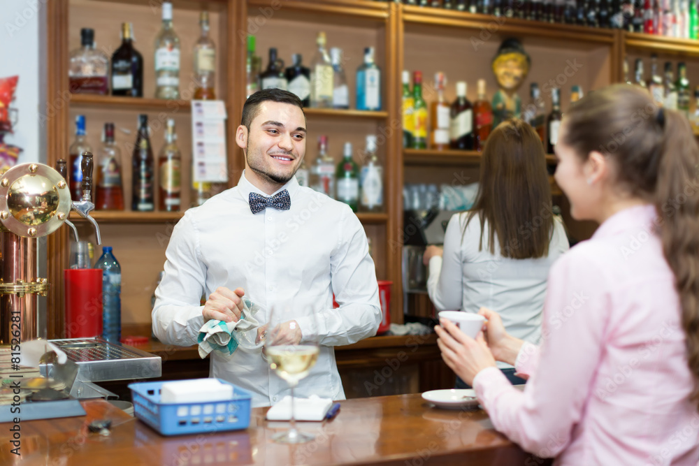 Fototapeta premium Young girl standing at bar