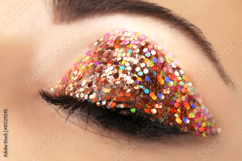 Female eye with fancy glitt...