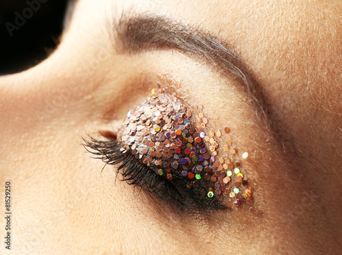 Female eye with fancy glitt...