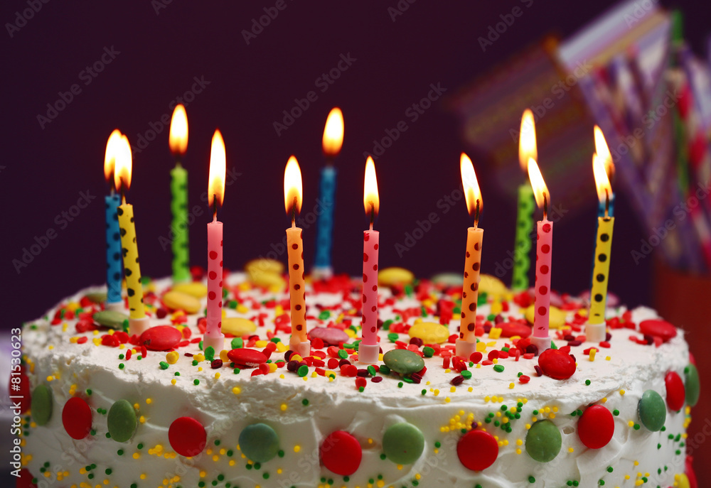 Birthday cake with candles on purple background Birthday cake with candles on purple background