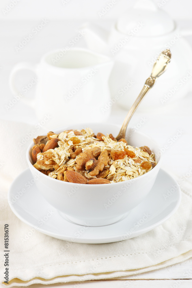 Oatmeal flakes with nuts in bowl Oatmeal flakes with nuts in bowl