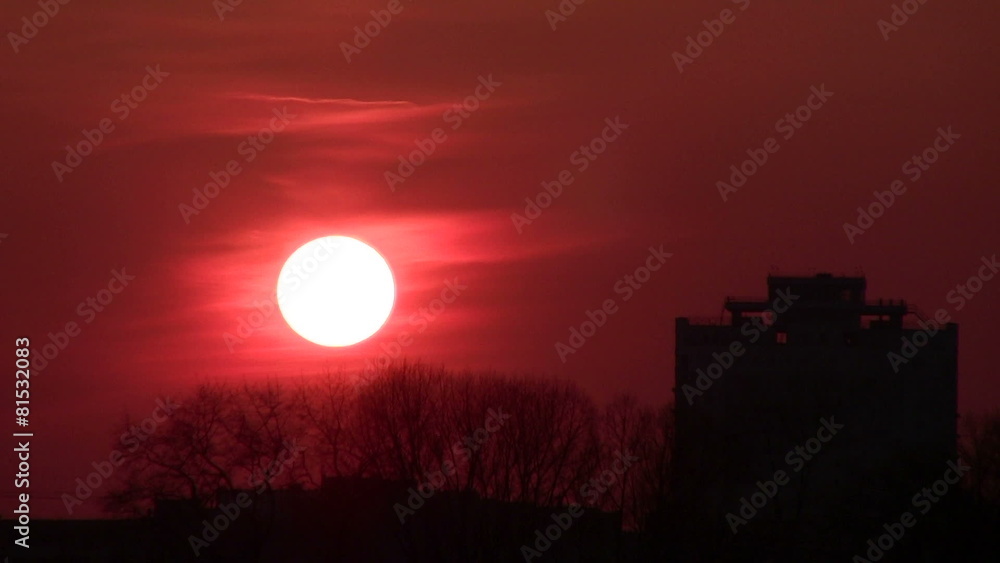 Red sunset over town houses. PAL Time lapse Red sunset over town houses. PAL Time lapse