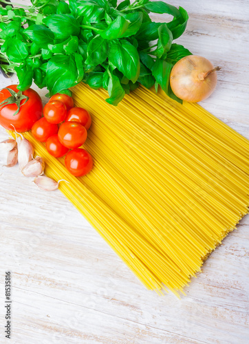 spaghetti ingredients on a white wooden table