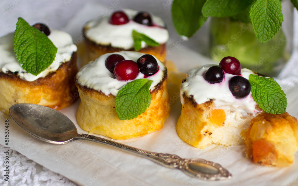 Curd pudding with candied fruit and fresh berries. Soft focus