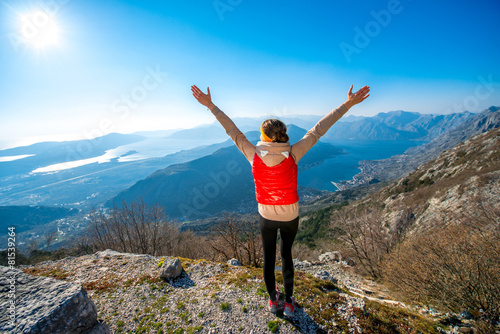 Sport woman on the top of mountain