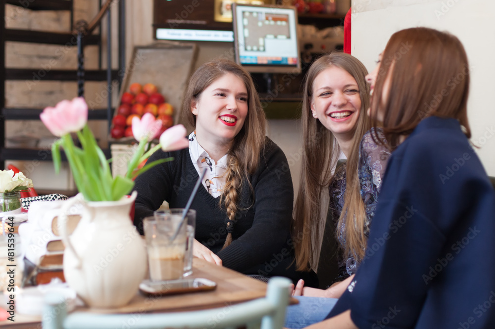 girls having a small talk in coffee shop girls having a small talk in coffee shop