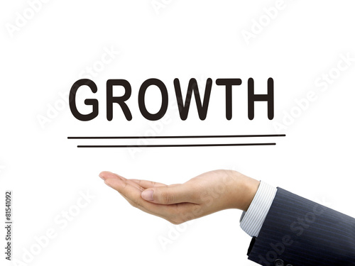 growth word holding by businessman's hand © JoyImage
