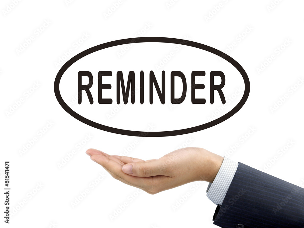 reminder word holding by businessman's hand reminder word holding by businessman's hand