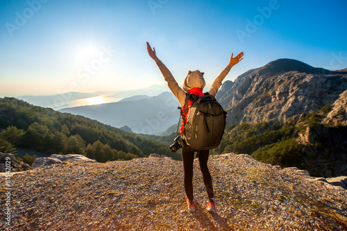 Young traveler photographer on the mountain