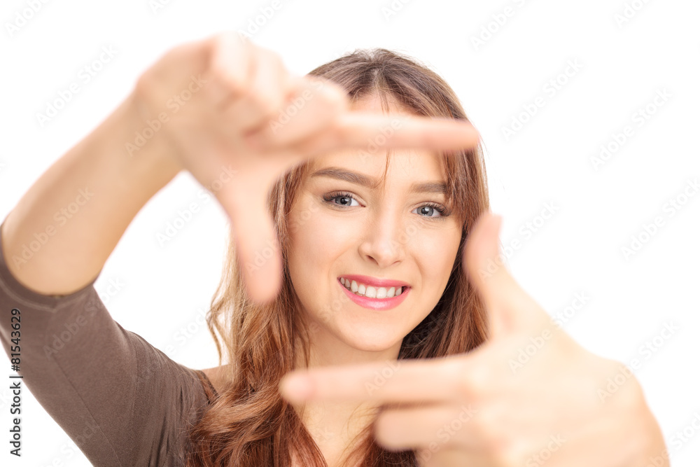 Beautiful girl framing a photo with her fingers Beautiful girl framing a photo with her fingers