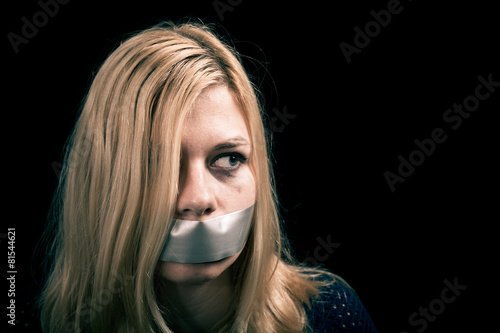 Fotografi Kidnapped woman hostage with tape over her mouth