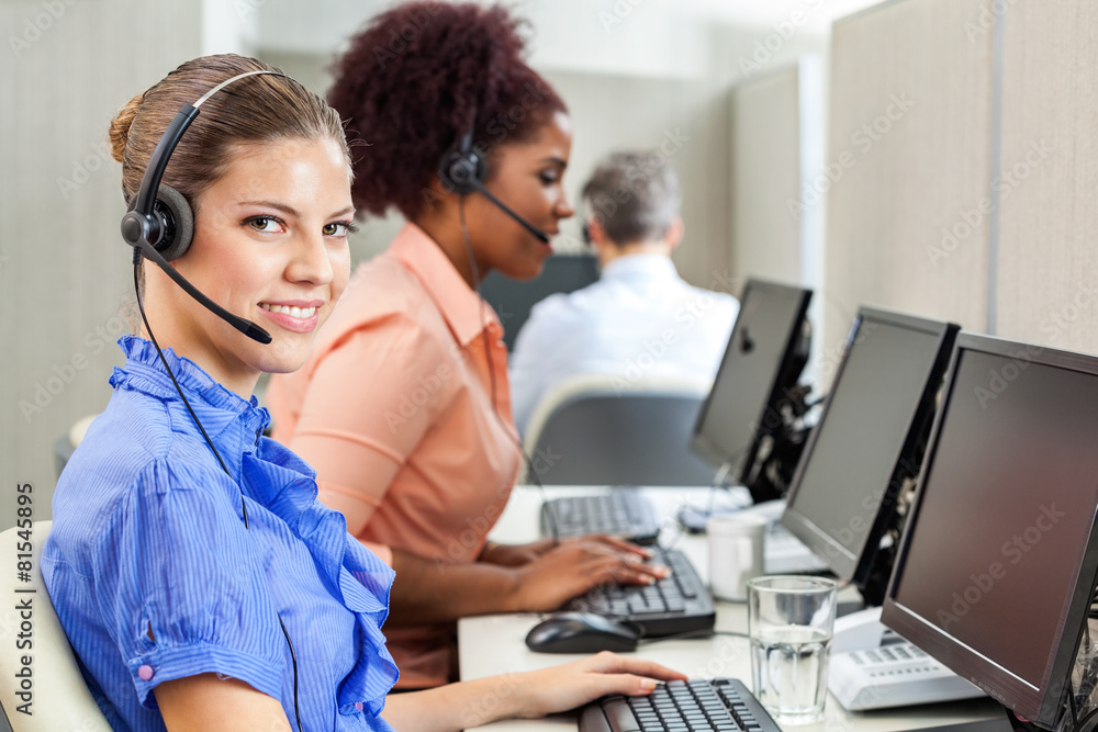 Happy Customer Service Agent Using Computer At Office Happy Customer Service Agent Using Computer At Office