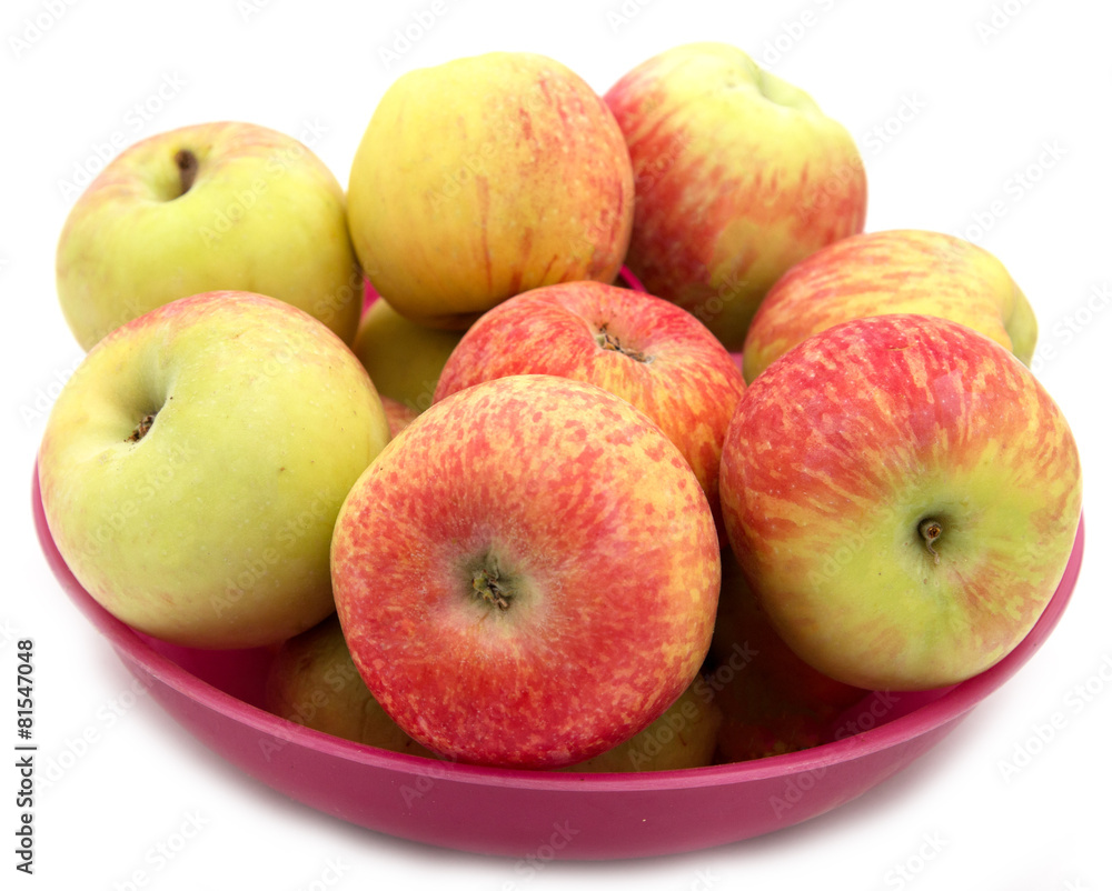 red and yellow apples in a red plate red and yellow apples in a red plate