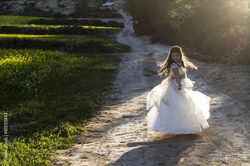 Girl ten years old with communion dress photo