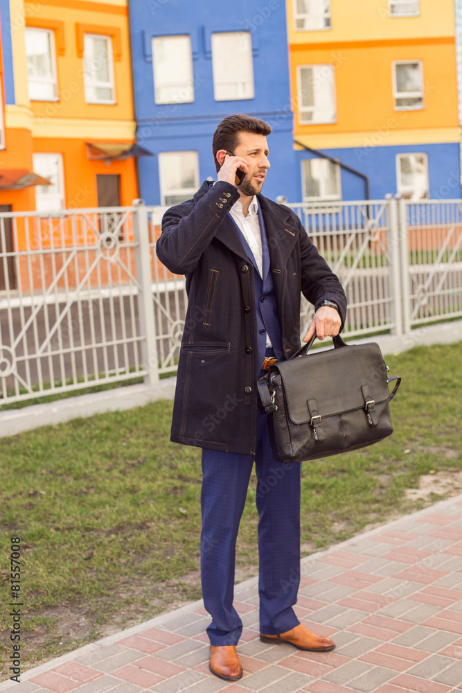 Fototapeta premium Businessman talking on mobile phone