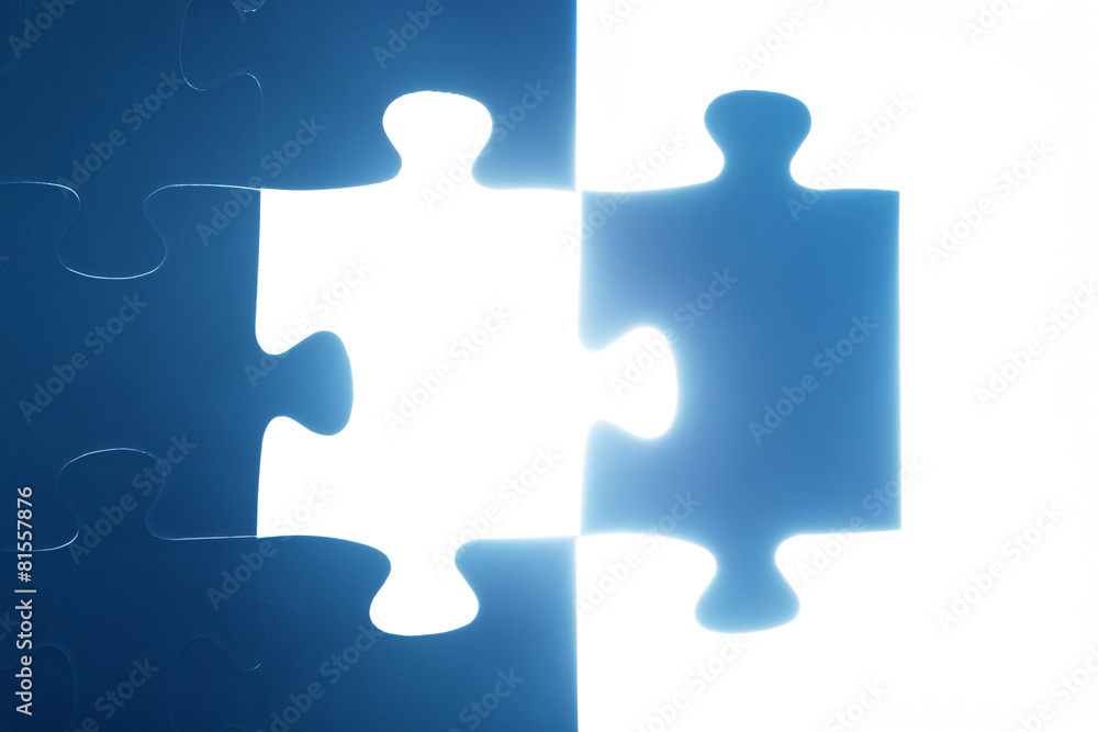 Jigsaw puzzle piece missing. Light glowing. Solution
